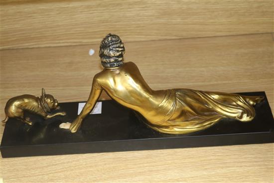 An Art Deco lady and dog figure group, on black marble base width 45cm height 19cm